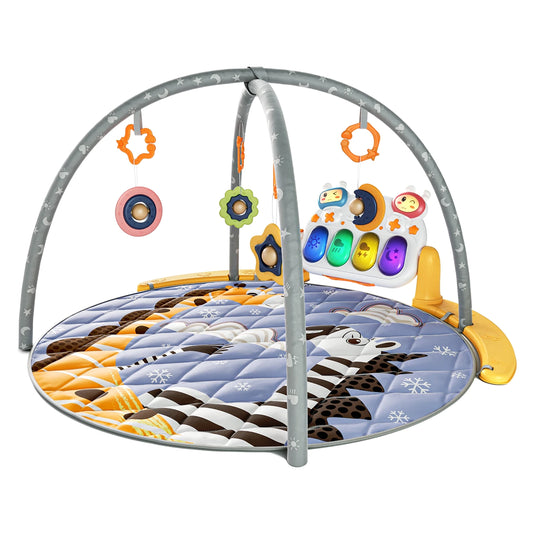 A colorful baby play gym featuring a soft, padded round mat with zebra and snowflake patterns. Two gray arches with star and moon prints cross over the mat, holding hanging toys (a star, flower, and circle with rattles). At the back, a detachable music and light activity panel with buttons shaped like animals, a moon, and colorful piano keys provides interactive fun for babies.
