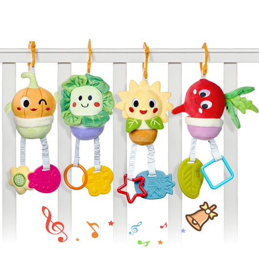 Four colorful plush hanging toys shaped like onion, cabbage, sunflower, and beetroot, clipped to a white baby crib. Each toy has a smiling embroidered face and dangling textured teethers in various shapes and colors, with playful music and bell icons illustrated at the bottom.