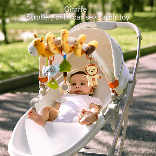 Baby lying in a stroller with a plush giraffe stroller arch toy overhead, featuring hanging soft toys including an elephant with teether, green tree rattle, clear ring rattle, and smiling monkey. Perfect for stroller, crib, or car seat entertainment, encouraging sensory development and motor skills.