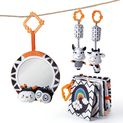 Set of high-contrast black, white, and orange baby sensory toys including a round mirror with plush owl and bee characters, two hanging cow plush toys with geometric patterns, and a soft cloth book with a rainbow cover, all featuring stroller or play gym clips.