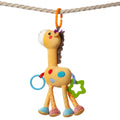 Plush giraffe baby toy hanging from a beige rope using an orange clip ring. The toy features colorful details, including polka-dot legs, a blue plastic ring, and a green star-shaped teether. Designed for sensory play and easy attachment to strollers, cribs, or car seats.