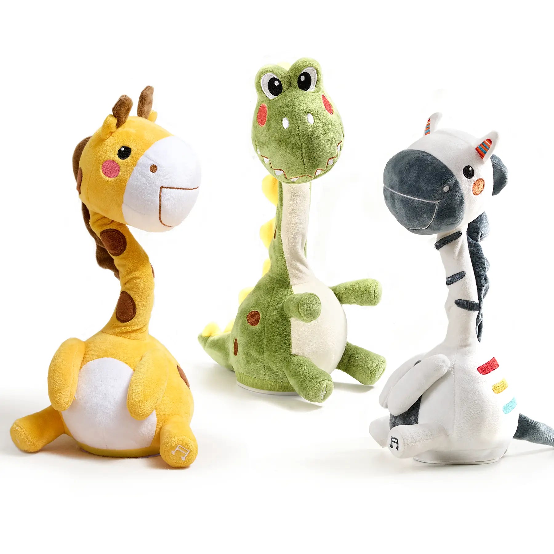 Three interactive dancing and singing plush animal toys including a yellow giraffe, a green dinosaur, and a white zebra with colorful accents, standing upright on a white background.