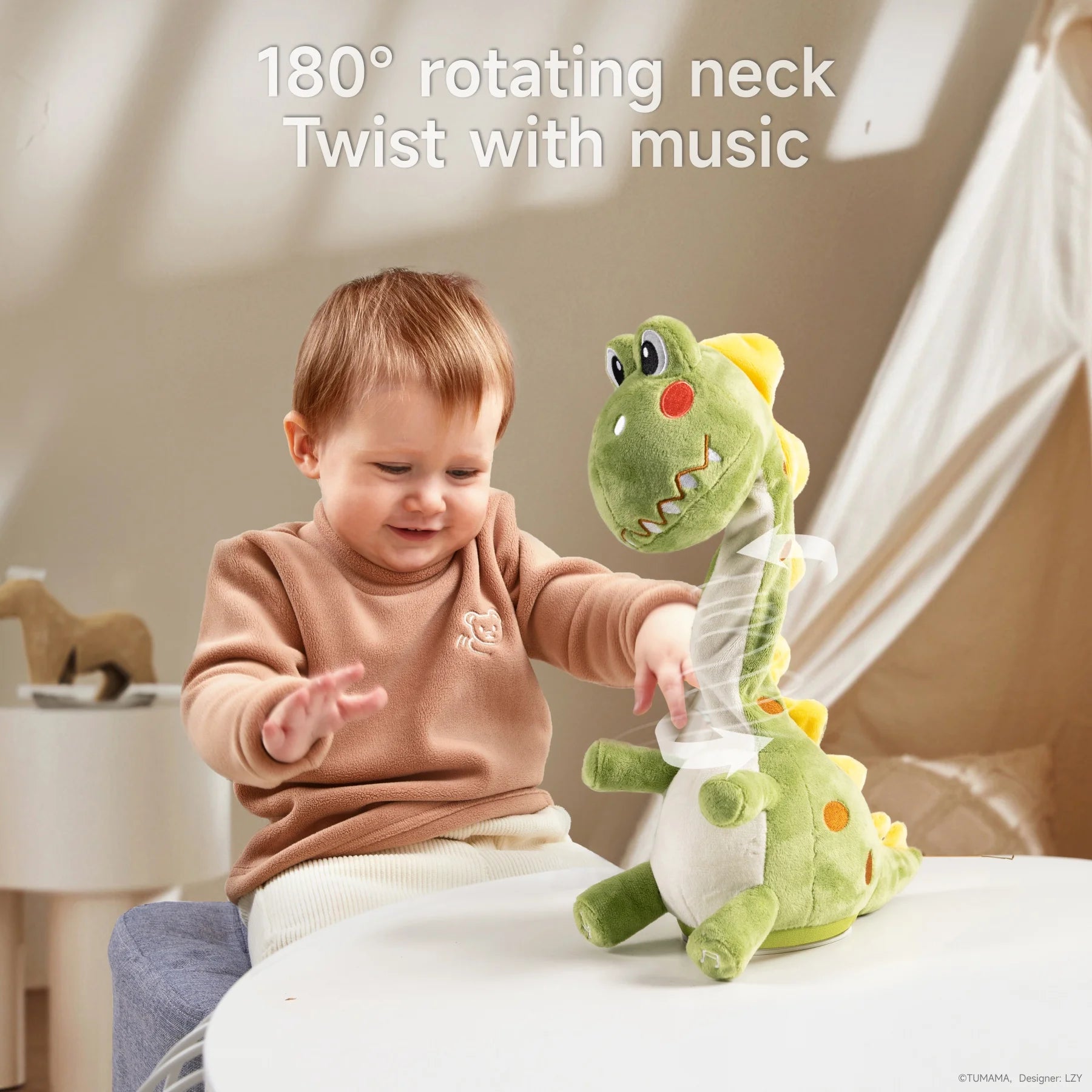 A smiling toddler sits at a table, playing with a green dinosaur plush electric interactive toy that has a 180° rotating neck. The toy’s head is shown twisting, and text above reads: “180° rotating neck — Twist with music.”