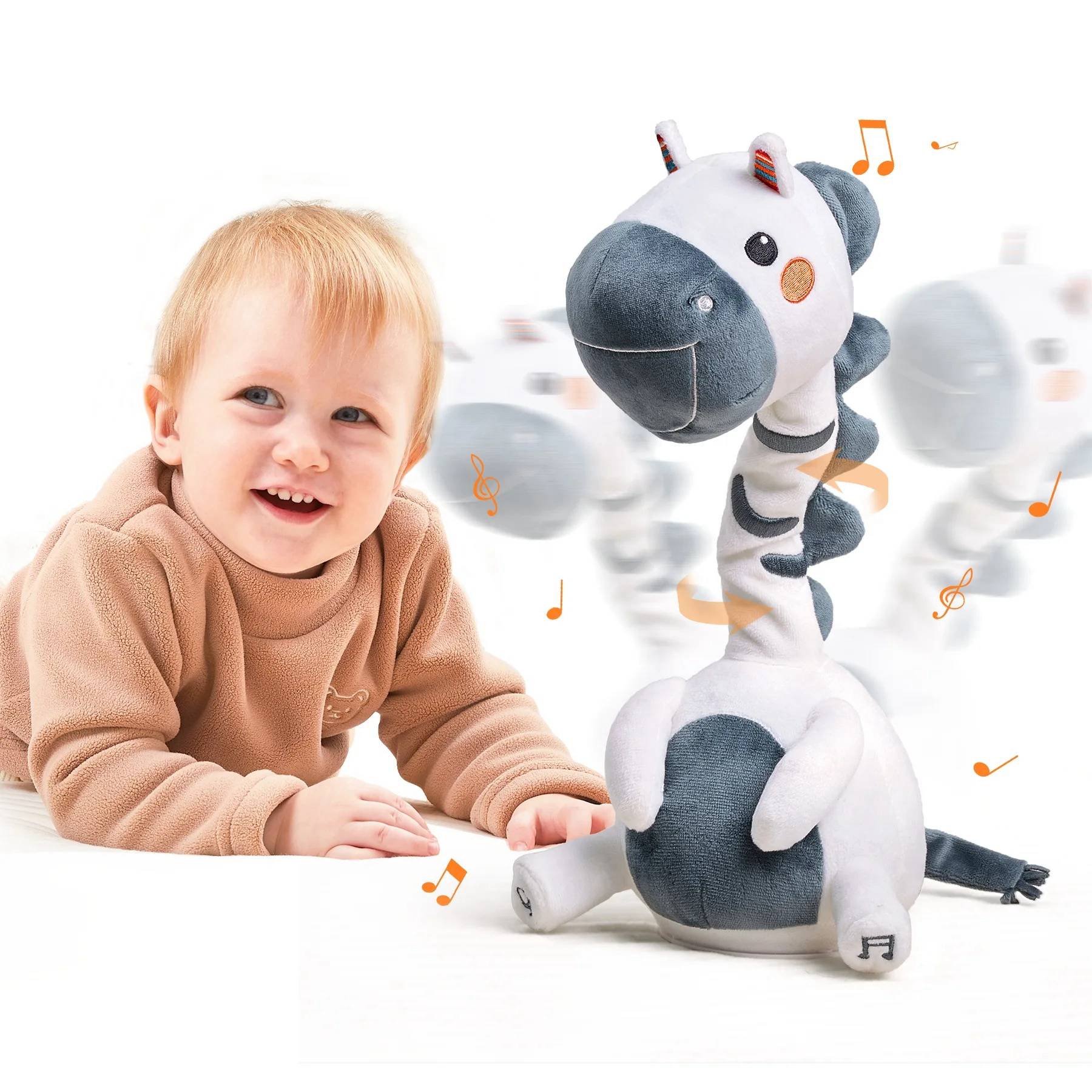 Smiling baby in a brown outfit lying on the floor next to a white and gray zebra plush electric interactive toy with a rotating neck, surrounded by music notes and motion blur indicating movement and sound.