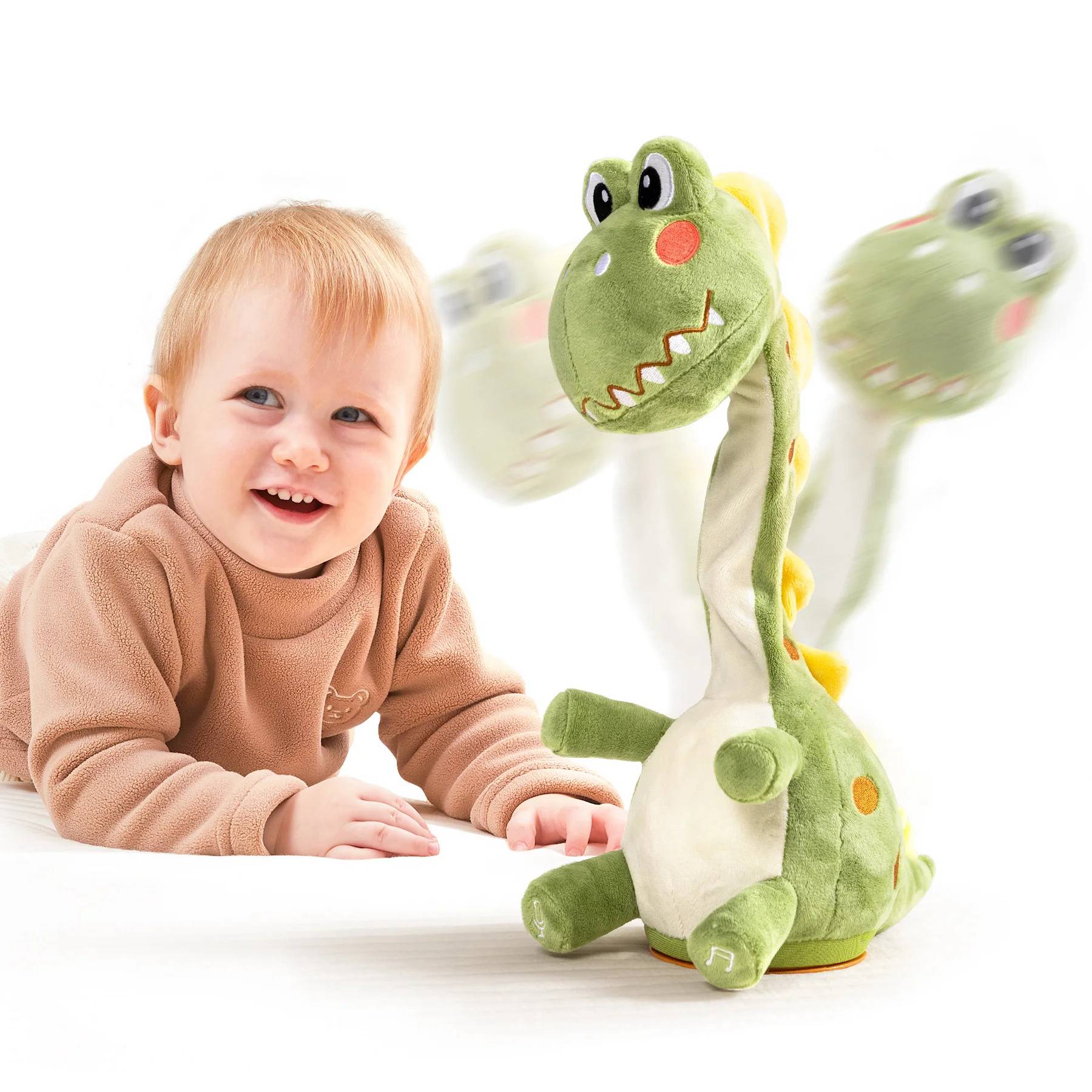 Happy baby in a brown outfit lying on the floor next to a green dinosaur plush electric interactive toy with a rotating neck, shown with motion blur to indicate movement and interaction.