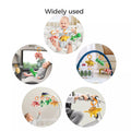 Collage of circular images showing three reversible plush dinosaur hanging toys used in various settings: clipped to a crib rail, attached in a car seat, hanging on a play gym arch, suspended from a mobile, and hooked to stroller handlebars