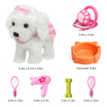 White plush toy dog dressed in pink lace with a pink bow, shown alongside pink and orange grooming accessories including a stethoscope (3.9in x 3.4in), pet bowl (5.8in diameter), mirror (4.0in x 1.5in), hairdryer (4.0in x 3.7in), green bone (3.1in x 1.3in), and brush (4.0in x 1.5in). Main dog size: 9.2in x 8.7in x 3.5in.