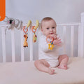 Baby-chews-and-plays-with-these-removable-baby-hanging-toys