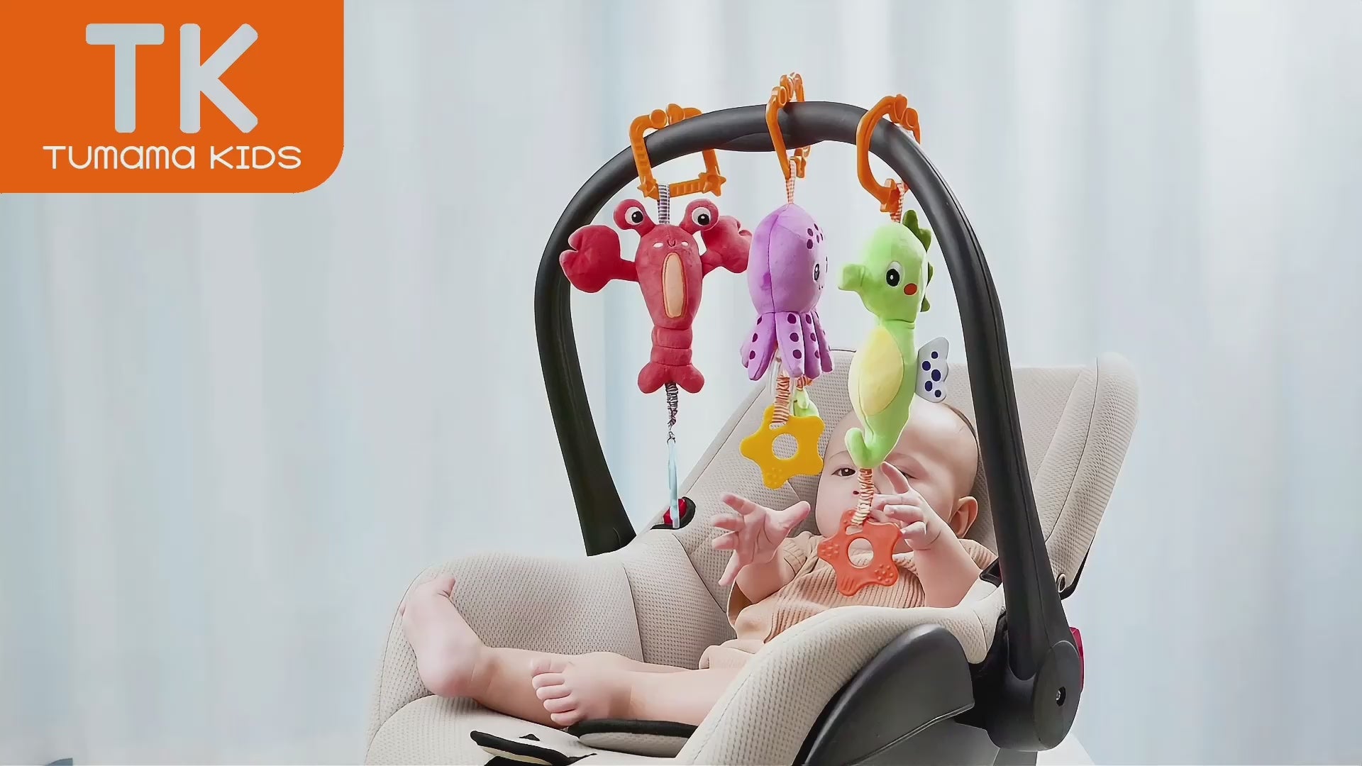 Baby-chews-and-plays-with-soft-seahorse-octopus-and-lobster-toys